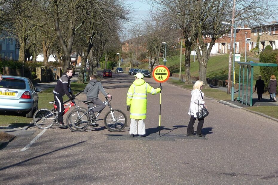 Bournemouth : Moore Avenue & Lollipop Lady A lollipop lady guides these people across the road and stops any oncoming traffic - but the road seemed very quiet.